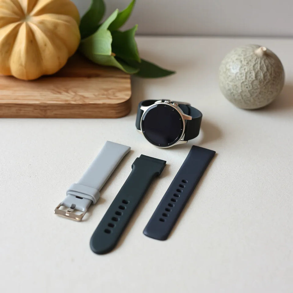 Huawei smartwatch with several silicone watch bands in different colors, showing strap texture and fit