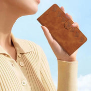 For iPhone 16 Seven Butterflies Embossed Leather Phone Case(Brown)