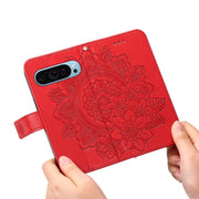 For Google Pixel 9 Seven-petal Flowers Embossing Leather Phone Case(Red)