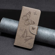 For iPhone 16 Pro Embossing Two Butterflies Pattern Leather Phone Case(Grey)
