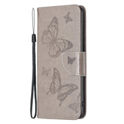 For iPhone 16 Pro Embossing Two Butterflies Pattern Leather Phone Case(Grey)