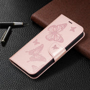 For iPhone 16 Embossing Two Butterflies Pattern Leather Phone Case(Rose Gold)