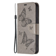 For iPhone 16 Plus Embossing Two Butterflies Pattern Leather Phone Case(Grey)