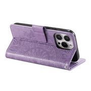 For iPhone 16 Pro Max Totem Flower Embossed Leather Phone Case(Purple)