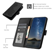 For iPhone 16e Datura Flower Embossed Flip Leather Phone Case(Black)