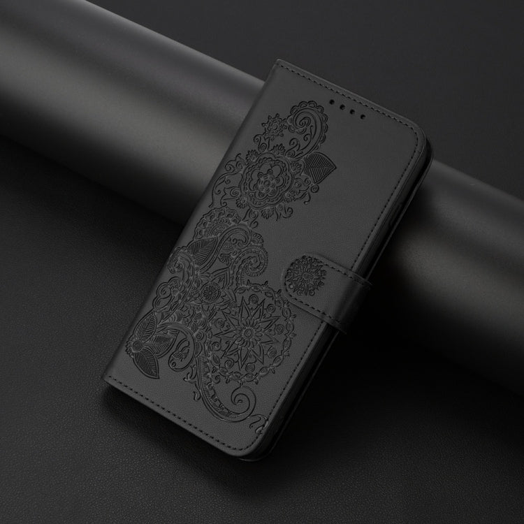 For iPhone 16 Plus Datura Flower Embossed Flip Leather Phone Case(Black)