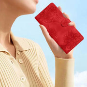 For iPhone 16e Cherry Blossom Butterfly Skin Feel Embossed PU Phone Case(Red)