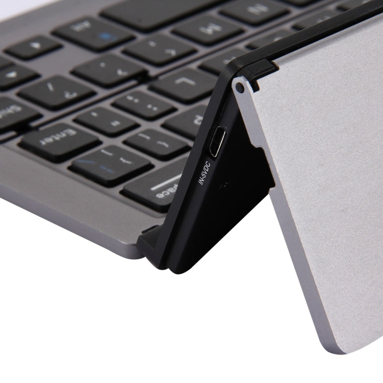 F18 Ultra-slim Rechargeable Foldable 58 Keys Bluetooth Wireless Keyboard with Holder (Grey)