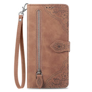 For Google Pixel 9 Pro Embossed Flower Zipper Leather Phone Case(Brown)
