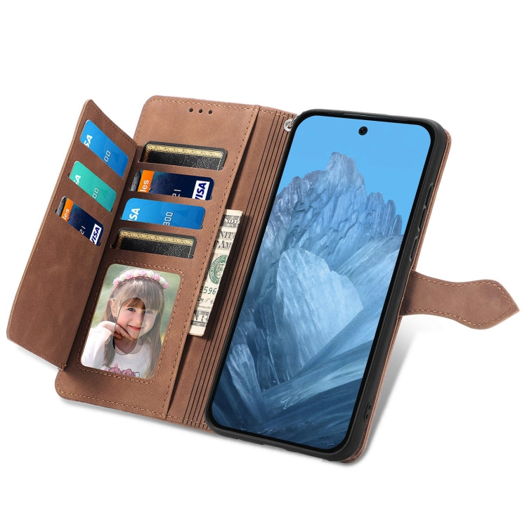 For Google Pixel 9 Pro Embossed Flower Zipper Leather Phone Case(Brown)