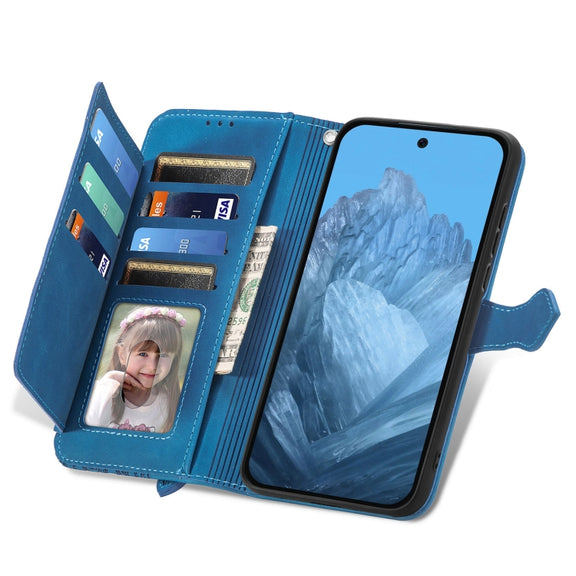 For Google Pixel 9 Embossed Flower Zipper Leather Phone Case(Blue)