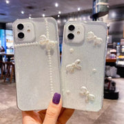For iPhone 16 Pearl Bow Glitter Epoxy TPU Phone Case(Cross Knots)