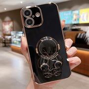 For iPhone 16 Embrace Stars Electroplating Astronaut Holder Phone Case(Black)