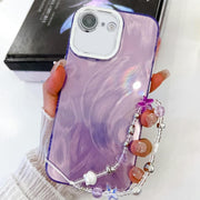 For iPhone 16e Plating Glitter Texture Chain Wristband TPU Phone Case with Lens Film(Purple Feather Yarn)