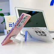 For Samsung Galaxy S25+ 5G Plating Glitter Texture Fold Holder TPU Phone Case with Lens Film(Pink Feathers)