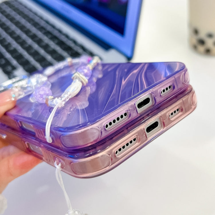 For iPhone 16 Plating Texture Wristband MagSafe TPU Phone Case with Glitter Lens Film(White Water Ripples)
