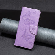 For iPhone 15 Embossing Two Butterflies Pattern Leather Phone Case(Purple)